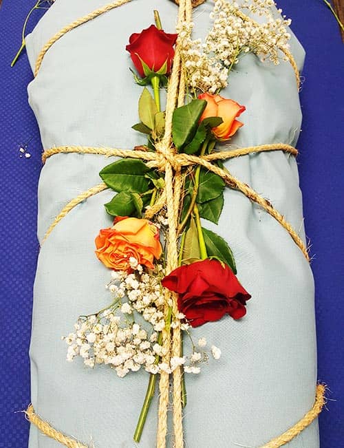 Full body burial at sea shroud torso flowers